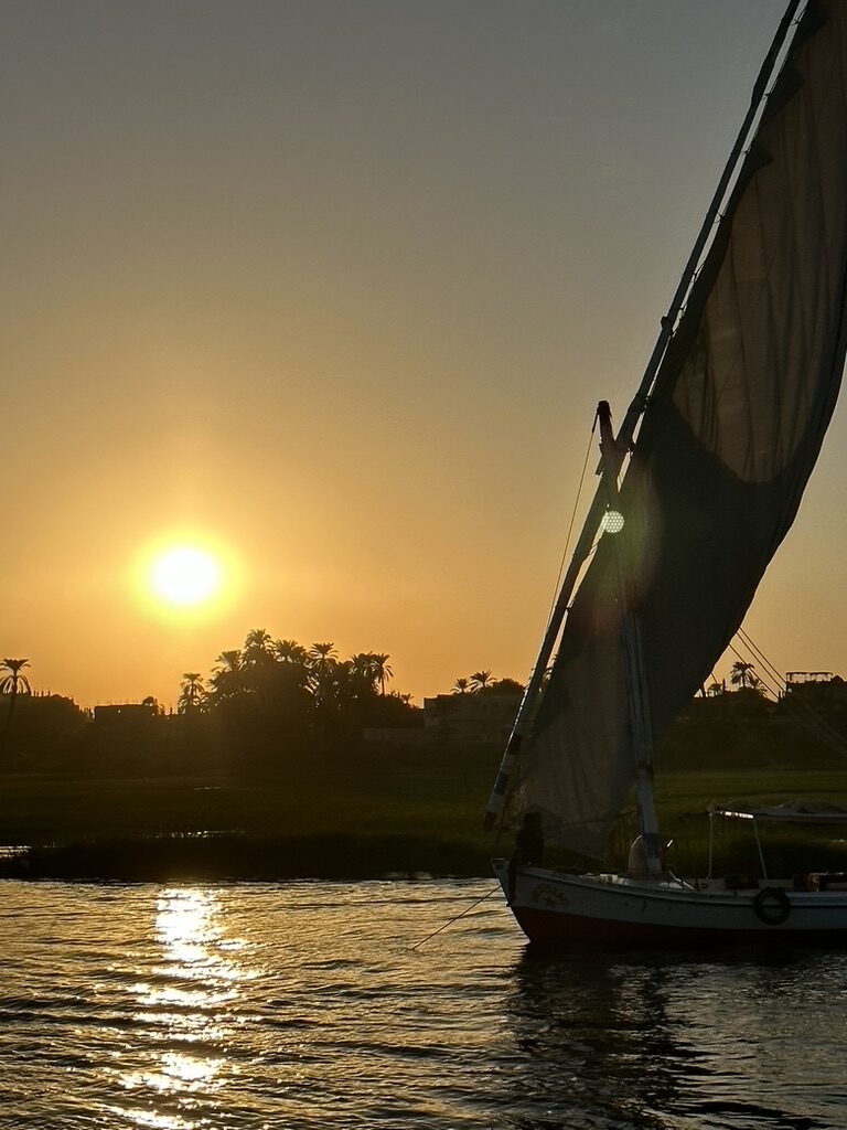 Traditional Egyptian felucca on the Nile at sunset